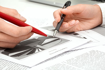 Close-up photo of two people examining a pie chart